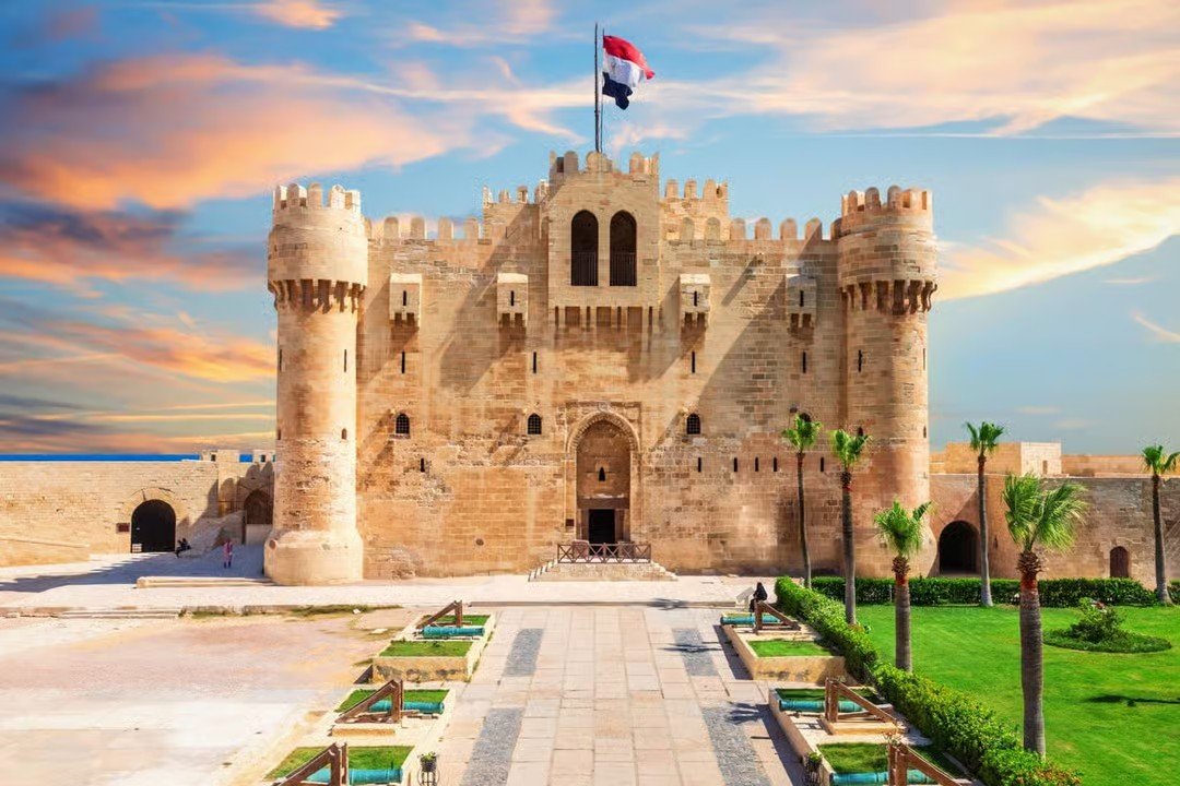 Text: Qaitbay Citadel overlooking the Mediterranean Sea in Alexandria, Egypt, featured on a historical day trip from Cairo.